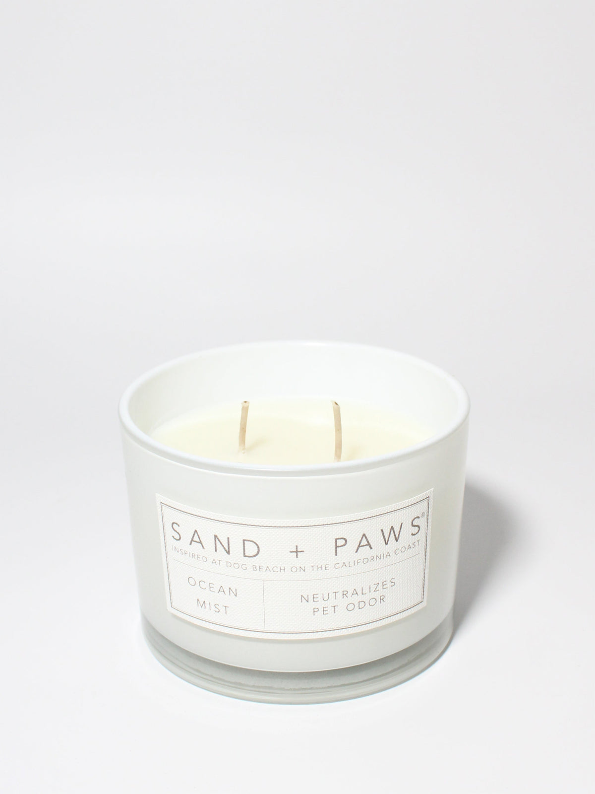 Sand + Paws Ocean Mist 12 oz scented candle White vessel with Carved Paw Print lid